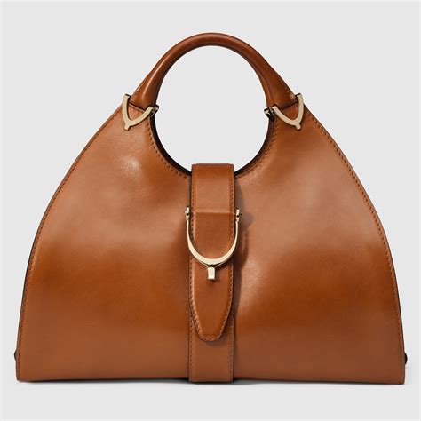 gucci stirrup medium top handle bag|GUCCI Calfskin Medium Stirrup Top Handle Bag Brown.